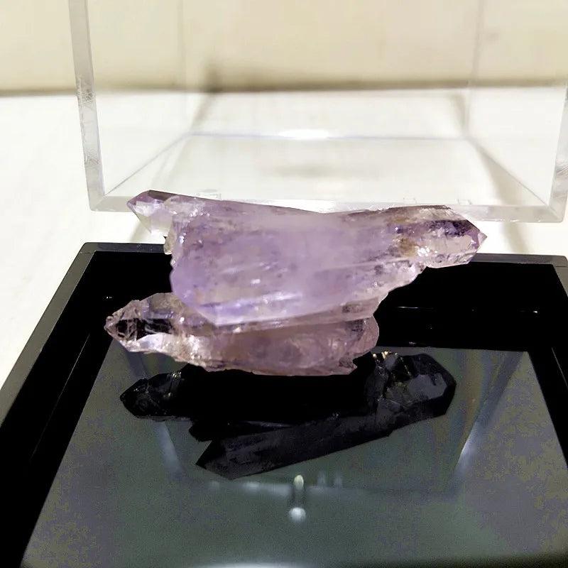Raw Vera Cruz Amethyst cluster with pale lavender points, showcasing natural clarity and high-vibration energy.