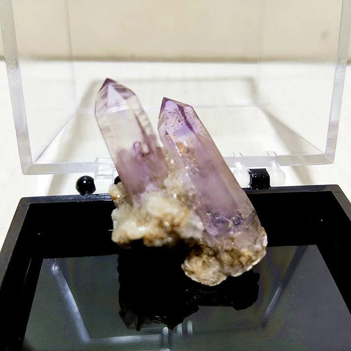 Raw Vera Cruz Amethyst cluster with pale lavender, transparent points for high-vibration spiritual healing and meditation.