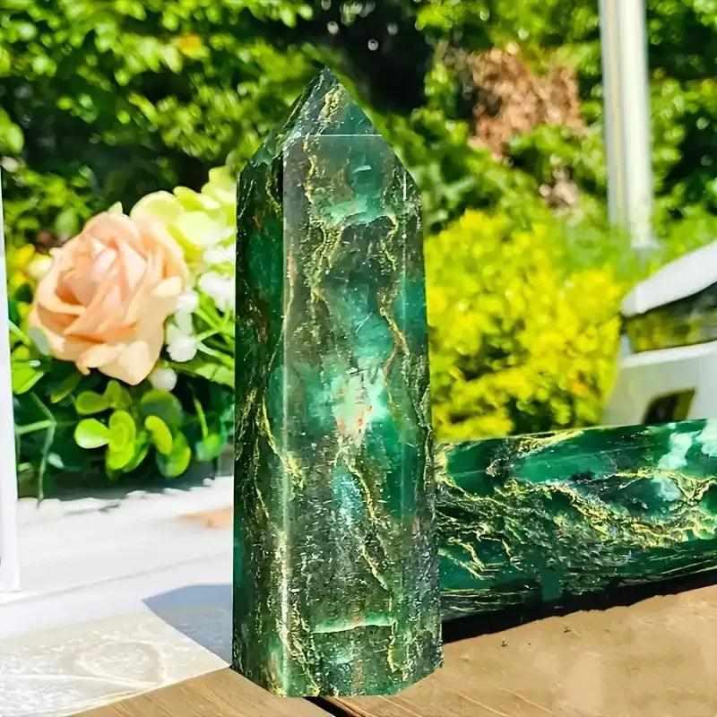 Polished green Verdite crystal tower with natural gold veining, perfect for grounding and heart-centered reflection.