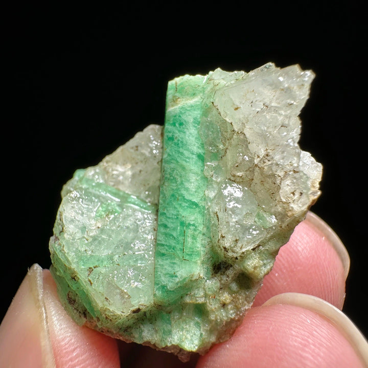 Raw Verdite mineral specimen featuring deep green stone and clear crystal formations for grounding and heart chakra healing.
