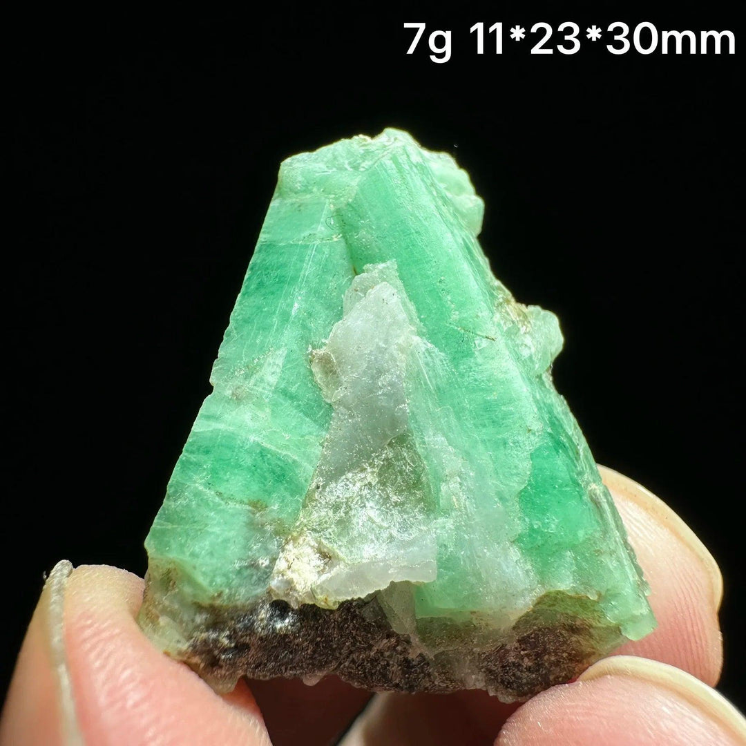 Natural Verdite mineral specimen, a deep green stone for grounding and heart chakra healing, held to show its raw texture.