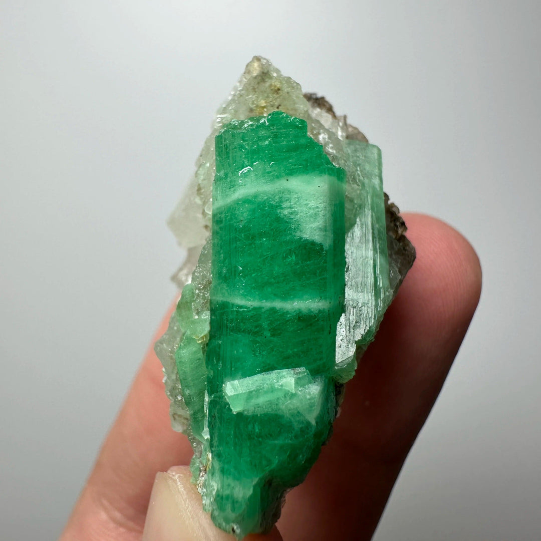 Raw Verdite mineral specimen featuring deep green, grounding stone crystals for heart and root chakra healing.