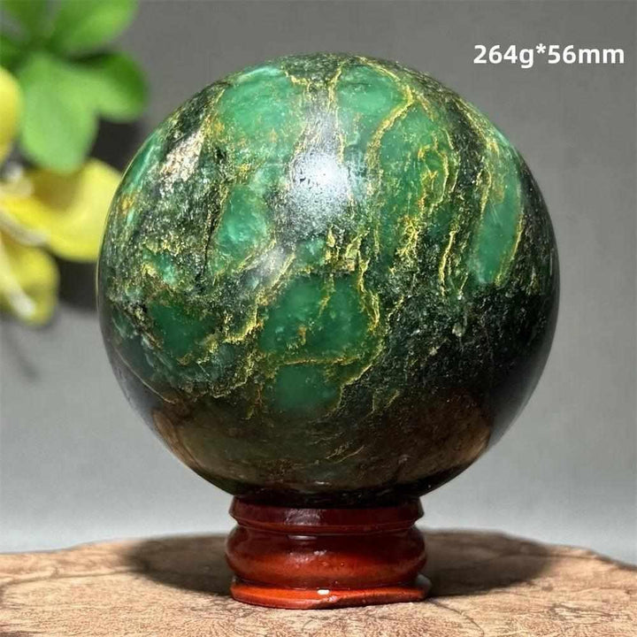 Polished 56mm verdite sphere in deep green with natural shading, perfect for grounding and heart chakra meditation.