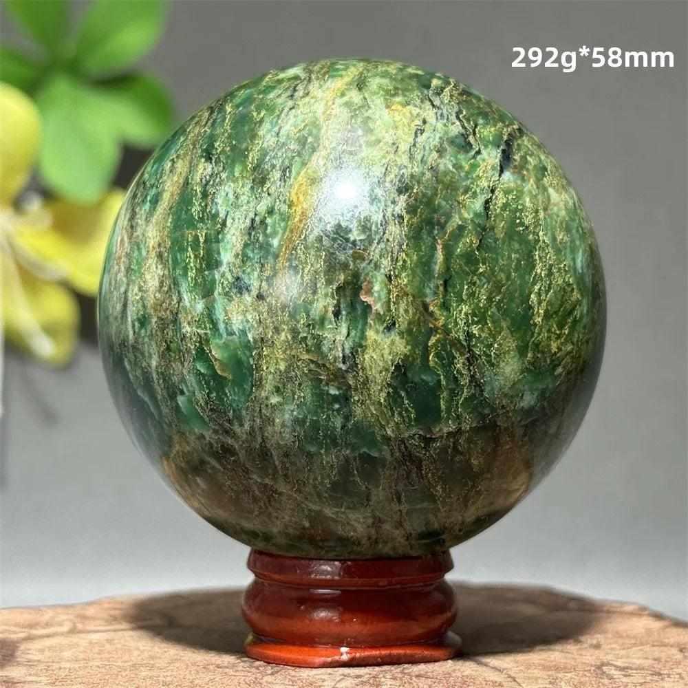 Polished 58mm verdite sphere in deep green with natural shading, perfect for Heart Chakra grounding and meditation.