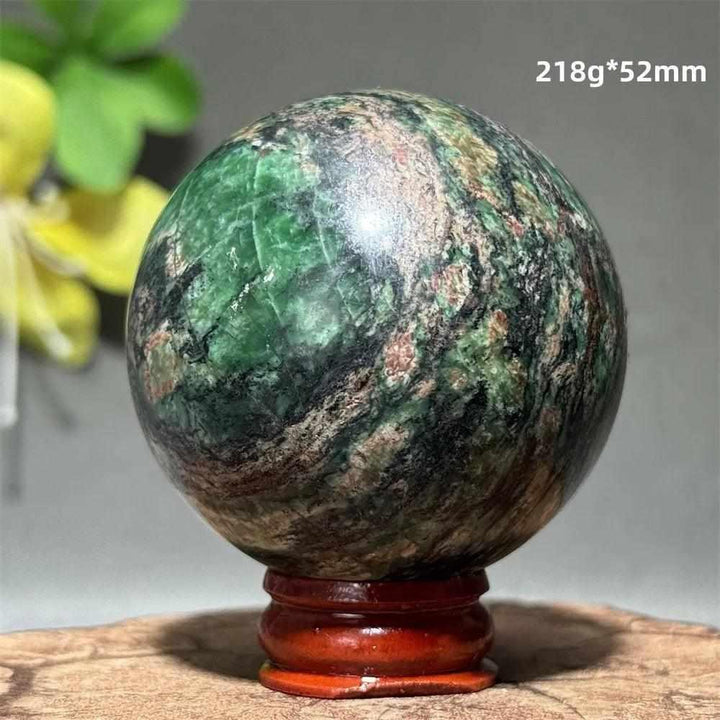 Polished 52mm verdite sphere in deep green with natural shading, perfect for Heart Chakra grounding and abundance.