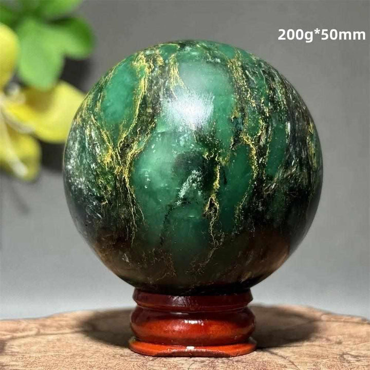 Polished 50mm verdite sphere in deep green with natural shading, perfect for grounding and heart chakra meditation.