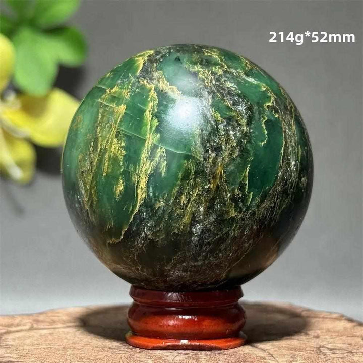 Polished 52mm verdite sphere in deep green with natural shading, perfect for heart chakra grounding and abundance.