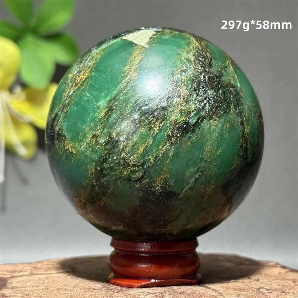 Polished 58mm verdite sphere in deep green with natural shading, perfect for Heart Chakra grounding and meditation.