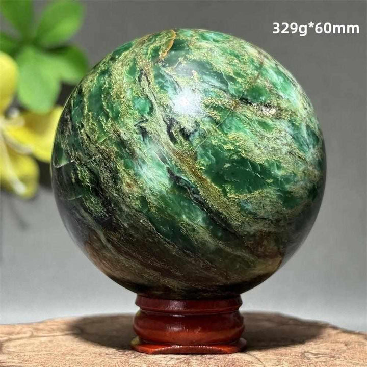 Polished 60mm verdite sphere featuring deep green natural shading for heart chakra grounding and steady growth.