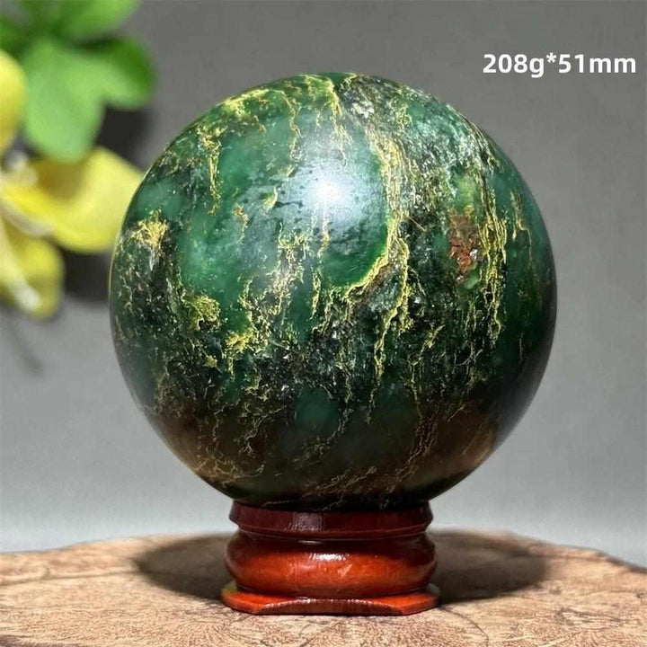 Polished 51mm verdite sphere in deep green with natural shading, perfect for Heart Chakra grounding and abundance.