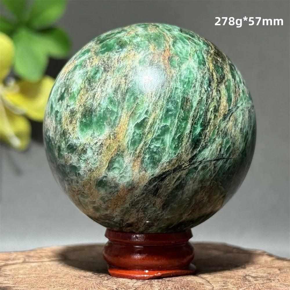 Polished 57mm Verdite sphere featuring deep green natural shading for heart chakra grounding and steady growth.