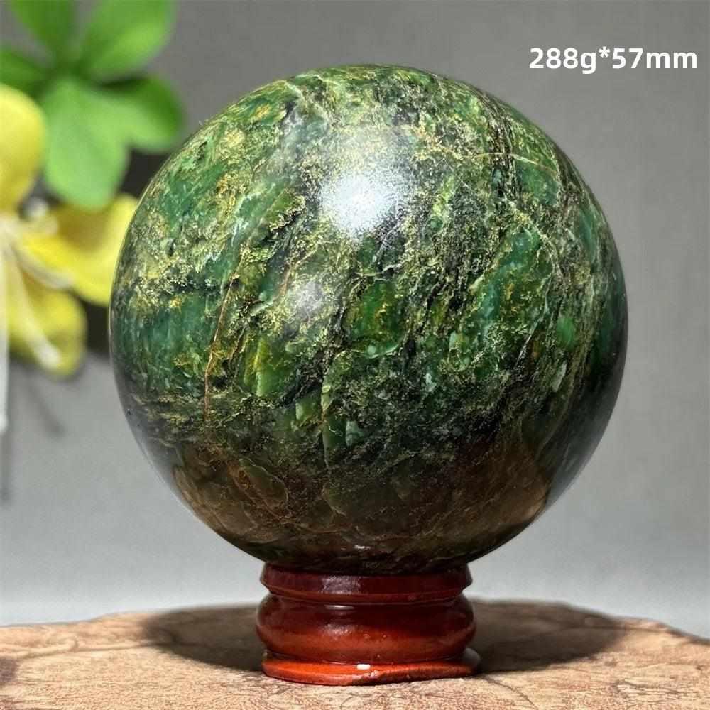 Polished 57mm verdite sphere in deep green with natural shading, perfect for grounding and heart chakra meditation.
