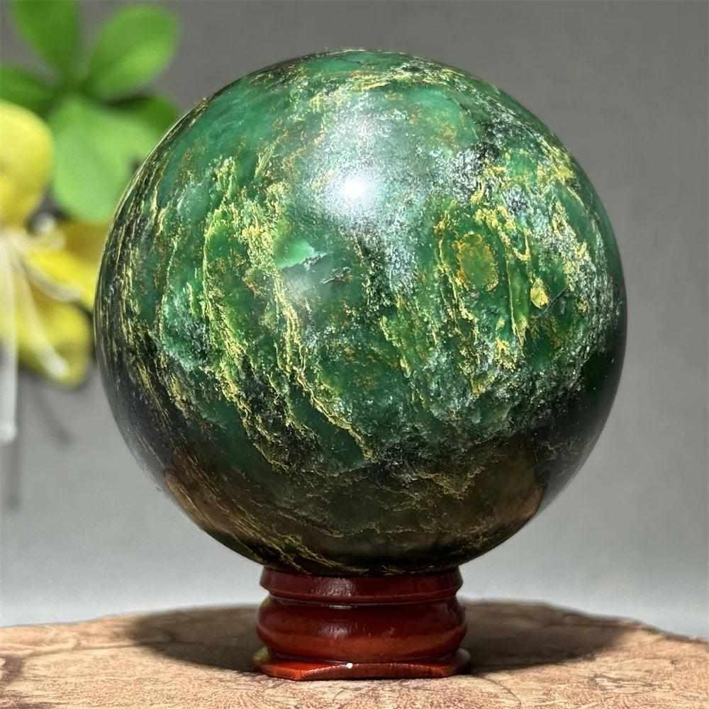 Polished deep green verdite sphere with natural shading, perfect for Heart Chakra grounding and abundance.