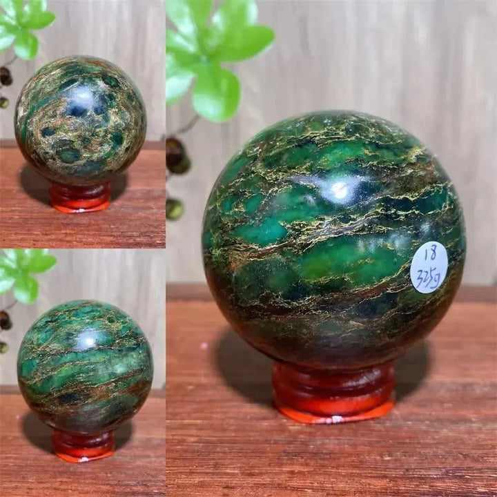 Verdite sphere with deep forest green and shimmering gold veins on a red display stand.
