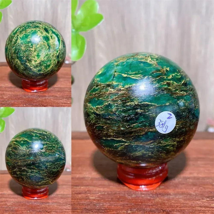 Polished Verdite sphere with deep green hues and shimmering gold veins, displayed on a reddish-brown stand.