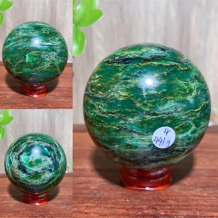 Verdite sphere with deep forest green and shimmering gold veins on a red stand.
