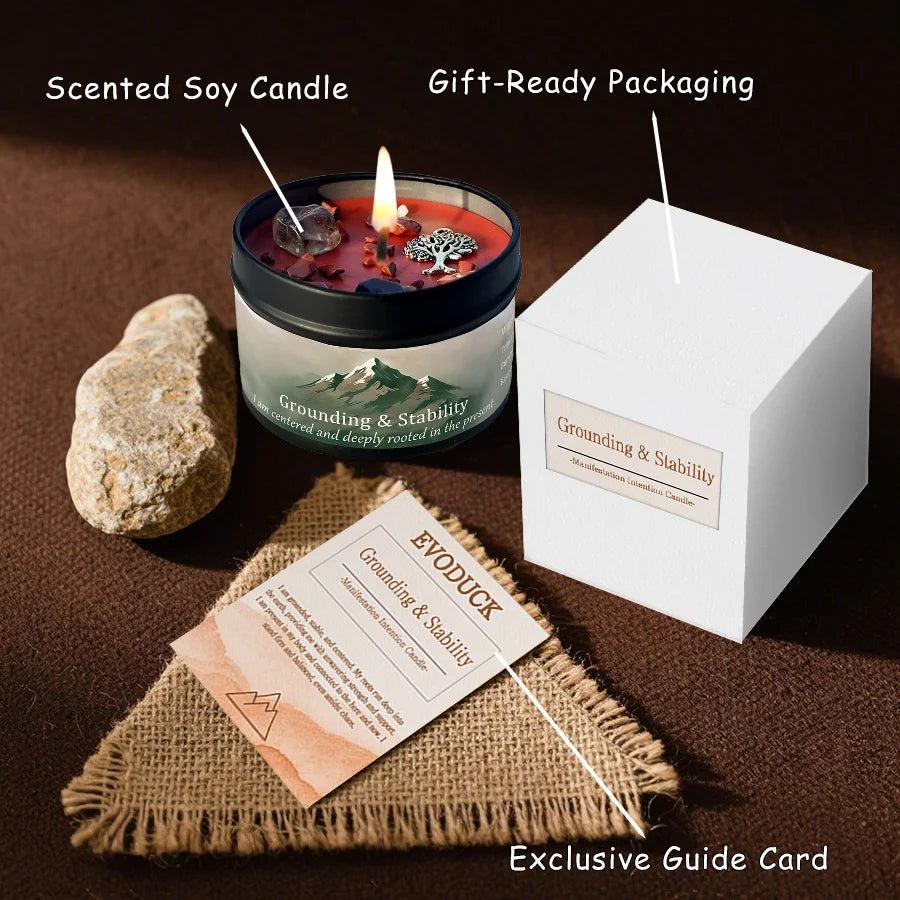 Vetiver Cedarwood "Grounding & Stability" crystal-infused candle in a black tin with red wax, stones, and a tree charm.
