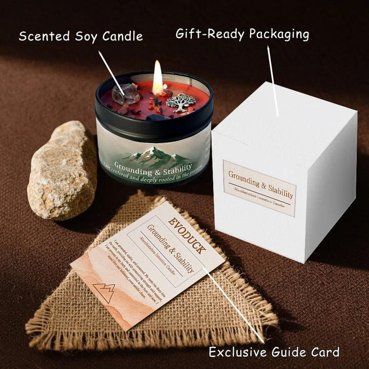 Vetiver Cedarwood "Grounding & Stability" crystal-infused candle in a black tin with red wax, stones, and a tree charm.