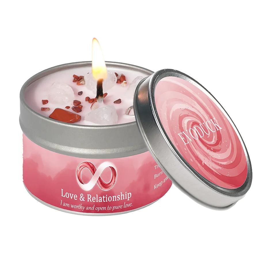 Vetiver Cedarwood "Love & Relationship" intention candle tin with clear quartz & red jasper, burning brightly.