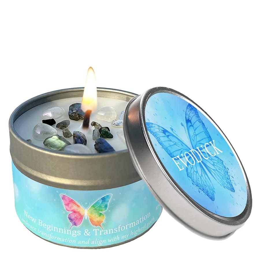 Vetiver Cedarwood crystal-infused intention candle tin with a lit wick, colorful stones, and a vibrant butterfly design.