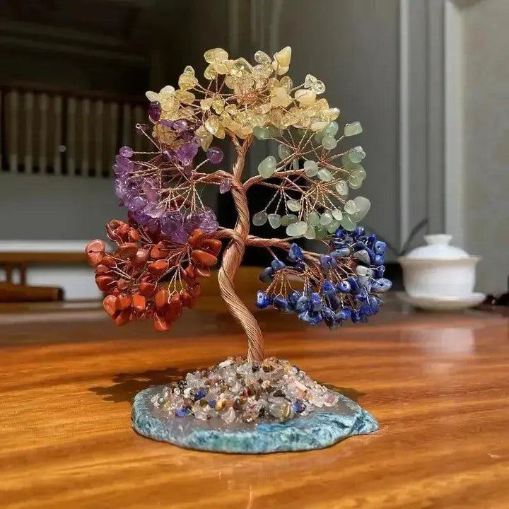 Handcrafted 110mm 7 Chakras Bonsai Tree with mixed gemstone leaves on a copper wire trunk and blue crystal base.