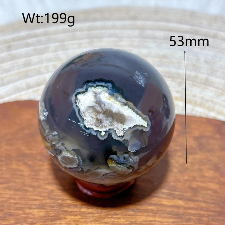 Volcanic Agate Sphere, a 53mm, 199g UV reactive crystal ball with earthy bands and a unique geode center.