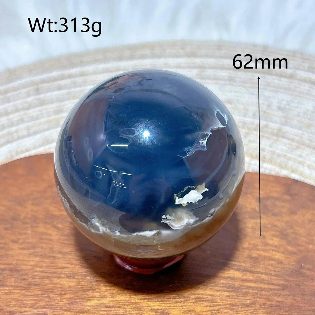 Volcanic Agate Sphere, a 62mm, 313g UV reactive crystal ball with rich dark bands and earthy tones.