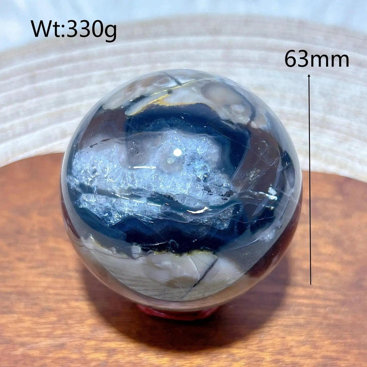 Volcanic Agate Sphere, 63mm, 330g. Earthy sphere with hidden fluorescent colors, grounding and transformative.