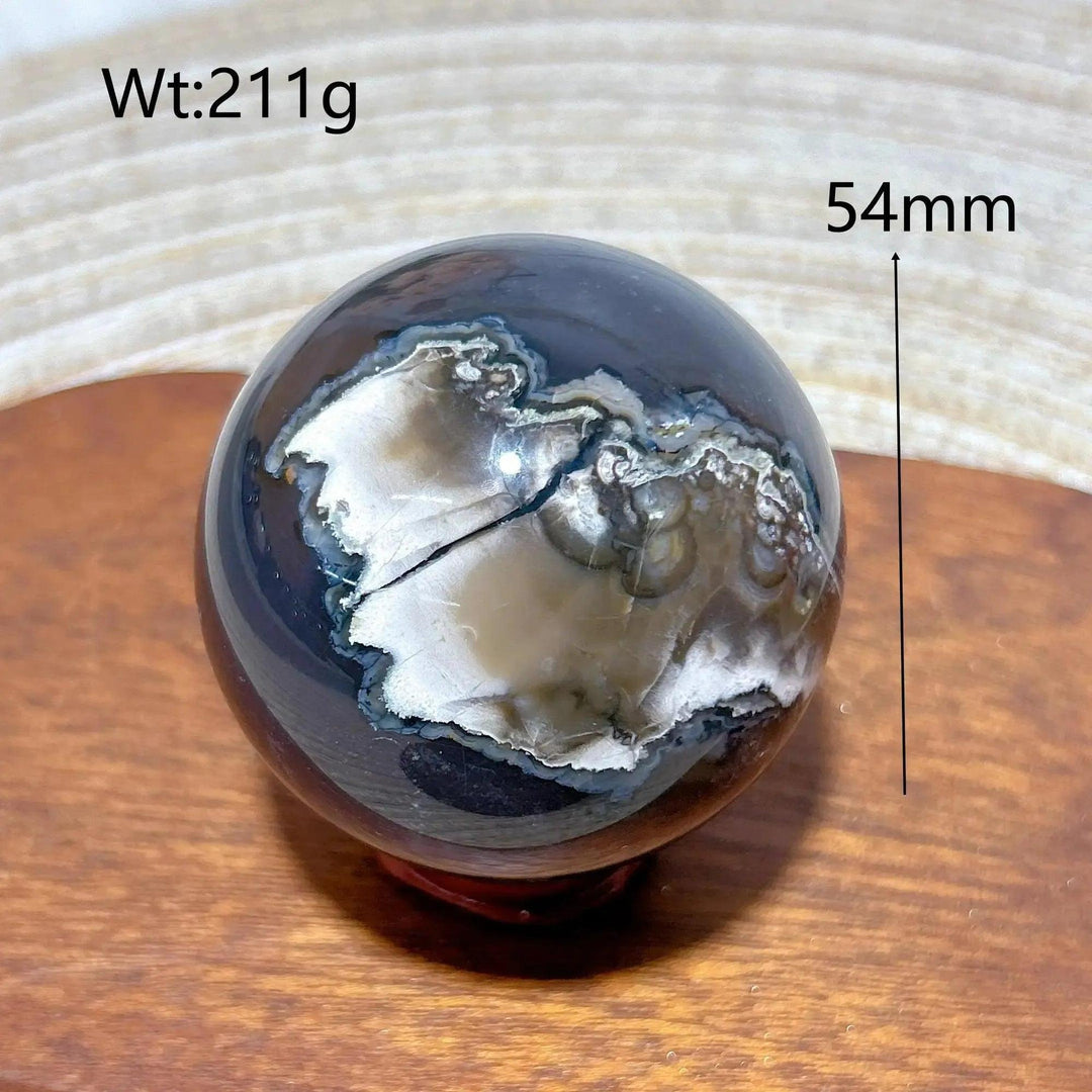 Volcanic Agate Sphere, a 54mm, 211g UV reactive crystal ball with unique earthy banding, grounding and transformative.
