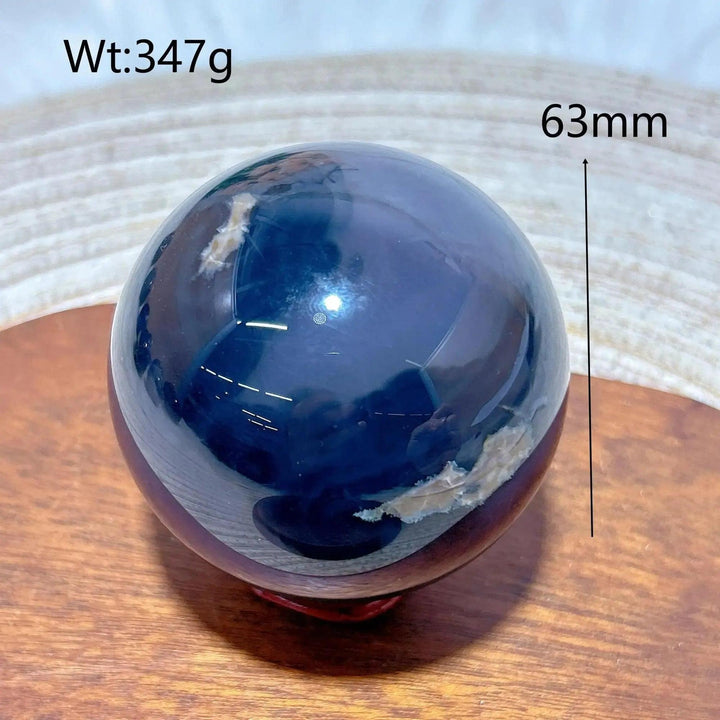 Volcanic Agate Sphere, a 63mm, 347g hand-polished, dark blue UV reactive crystal ball with earthy bands.