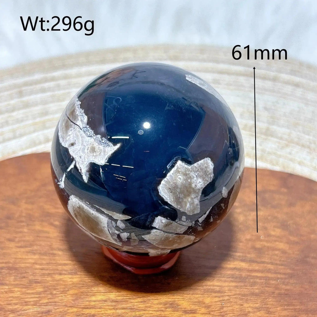 Volcanic Agate Sphere, a 61mm, 296g UV reactive crystal ball with rich banding and earthy tones.
