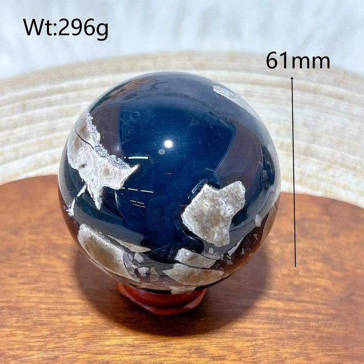 Volcanic Agate Sphere, a 61mm, 296g UV reactive crystal ball with rich banding and earthy tones.