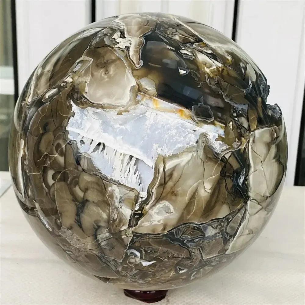 UV Reactive Volcanic Rock Agate Sphere: Mesmerizing deep forest green and vibrant blood red sphere with glowing fluorescence.