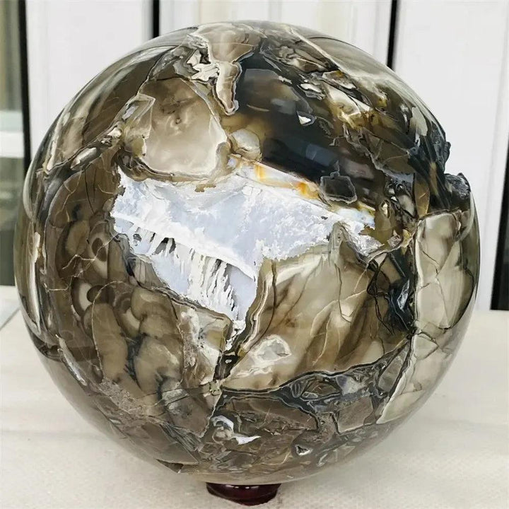 UV Reactive Volcanic Rock Agate Sphere: Mesmerizing deep forest green and vibrant blood red sphere with glowing fluorescence.