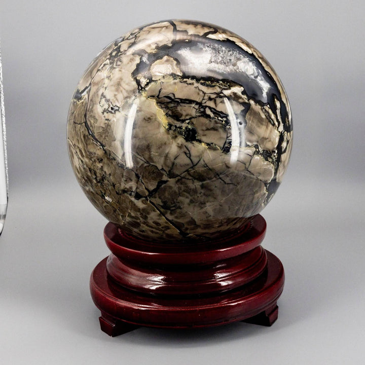 Volcano Agate Sphere XXL, 47lbs, UV Reactive. Hand-polished with swirling volcanic banding in rust, cream, deep brown, and ochre.