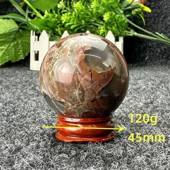 Volcano Agate sphere, 120g, 45mm, with fiery earth tones on a wooden stand from Crystal Destiny.