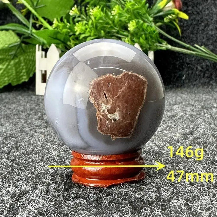 Polished gray and brown Volcano Agate sphere on a wooden stand, 146g, 47mm, from Crystal Destiny.
