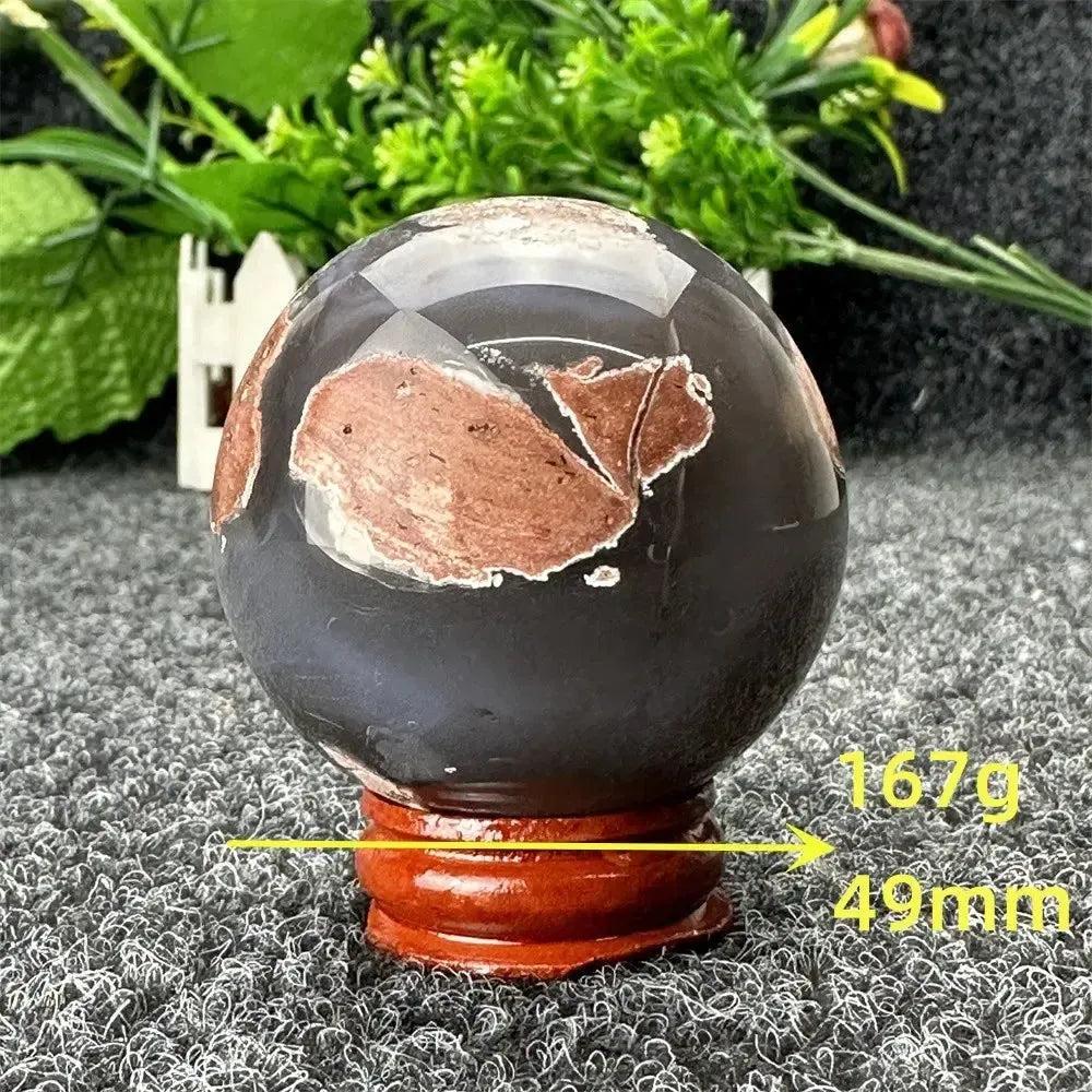 Polished Volcano Agate sphere, 167g, 49mm, with fiery earth tones on a dark base, from Crystal Destiny.