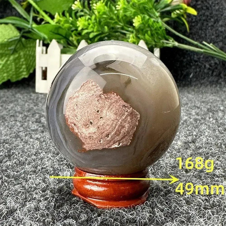 Volcano Agate sphere by Crystal Destiny, 168g, 49mm. Polished, with gray, brown, and rusty red patterns.