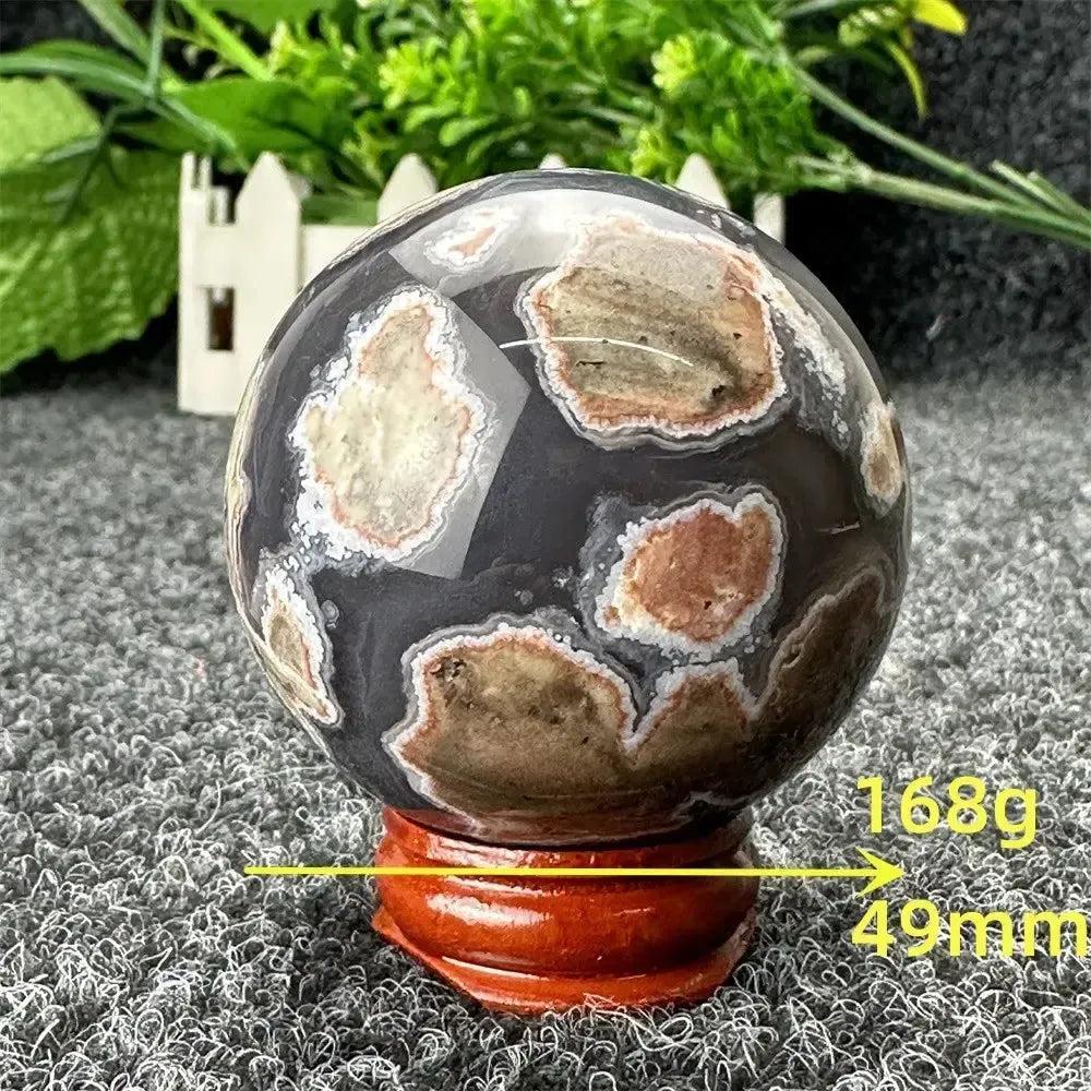 Volcano Agate sphere, 49mm, 168g, with fiery earth tones and dramatic patterns from Crystal Destiny.