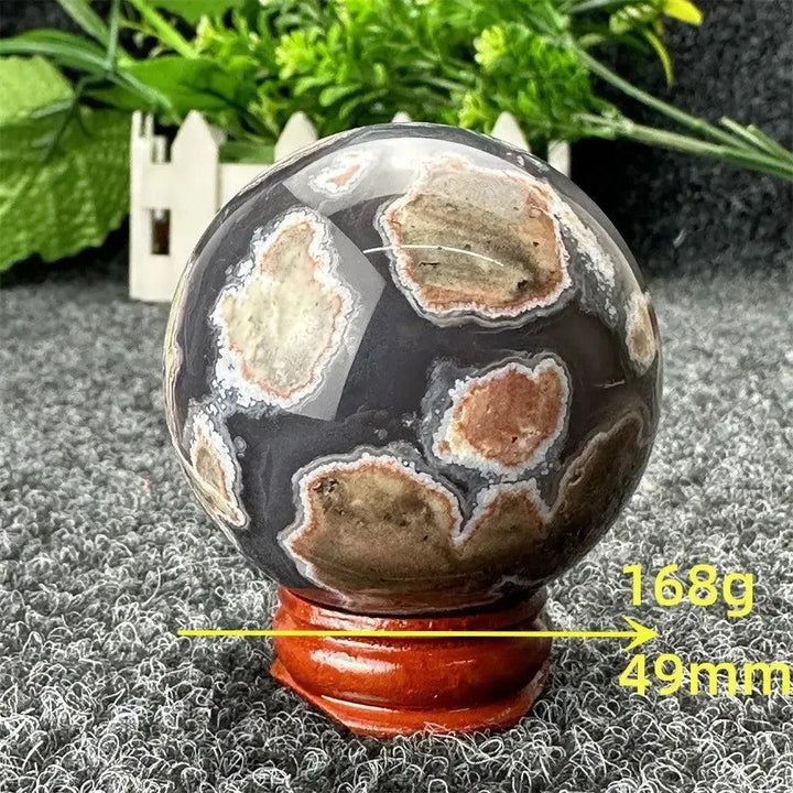 Volcano Agate sphere, 49mm, 168g, with fiery earth tones and dramatic patterns from Crystal Destiny.
