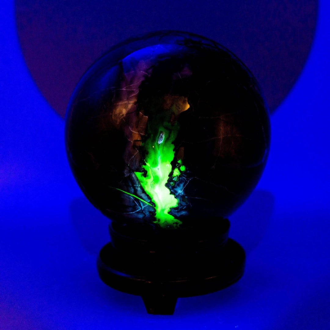 Volcano Agate Sphere, 186mm, glowing vibrant green under UV light, commanding a room.