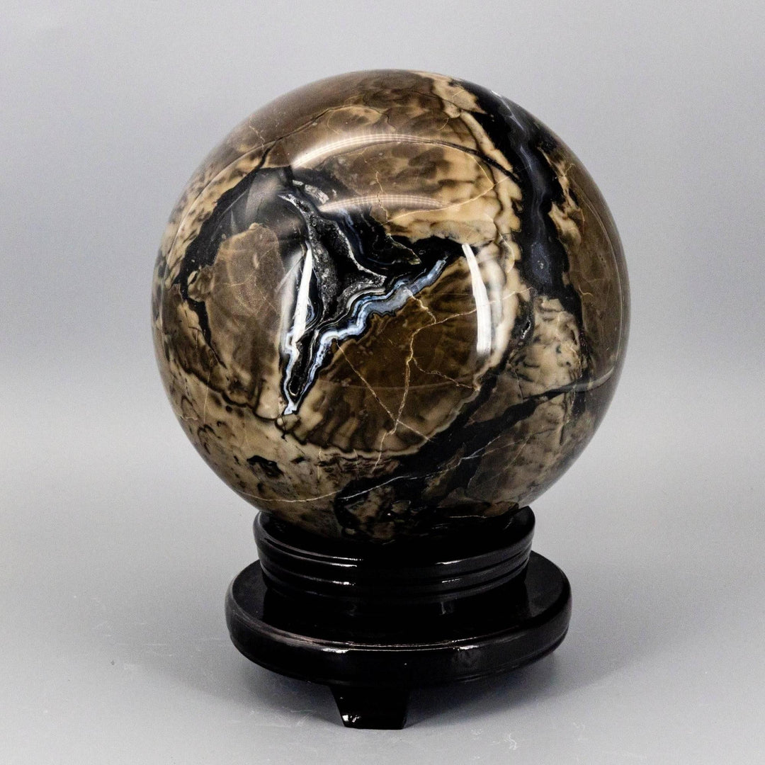 HUGE 186mm Volcano Agate Sphere, UV Reactive, with swirling volcanic banding in rust, cream, and deep brown.