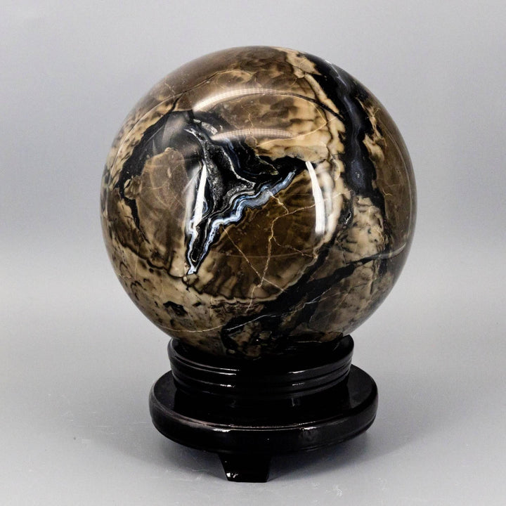 HUGE 186mm Volcano Agate Sphere, UV Reactive, with swirling volcanic banding in rust, cream, and deep brown.