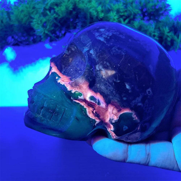Hand-carved Volcano Agate and Calcite crystal skull with vibrant glowing accents for Reiki healing and home decor.