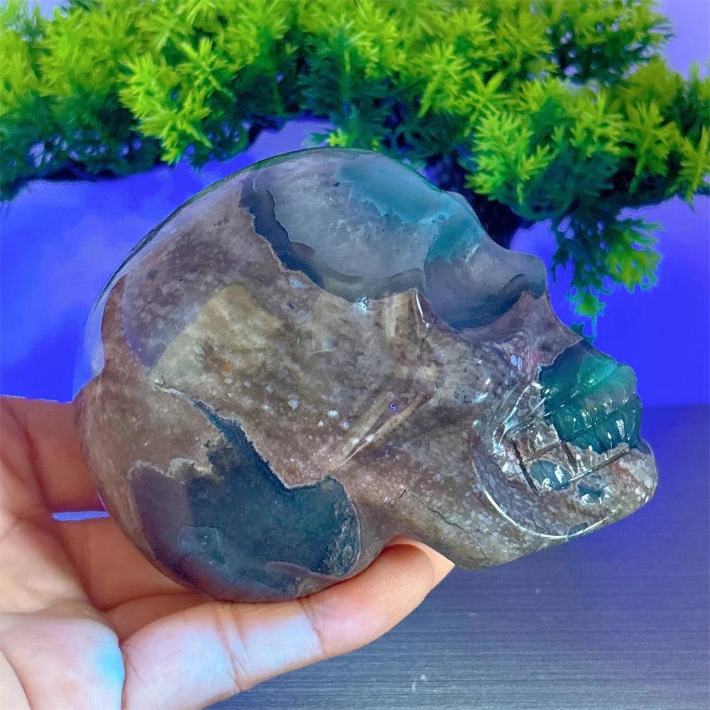 Hand-carved Volcano Agate and Calcite crystal skull, a unique healing stone for Reiki energy and decorative home luck.