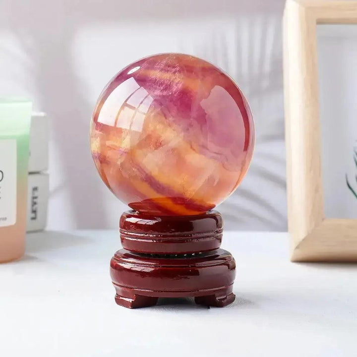 Watermelon Fluorite Crystal Sphere: vibrant green, pink, and purple hues for mental clarity and focus.