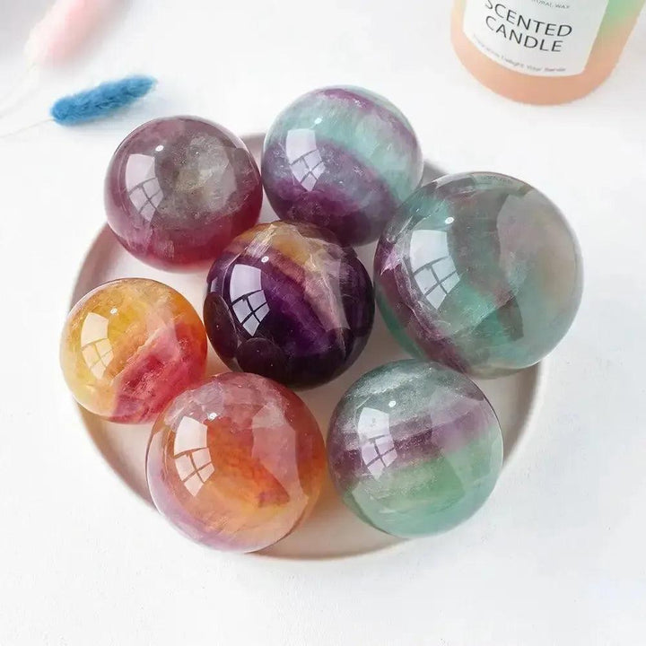Watermelon Fluorite Crystal Spheres: Vibrant green, purple, and pink polished stones for mental clarity and focus.