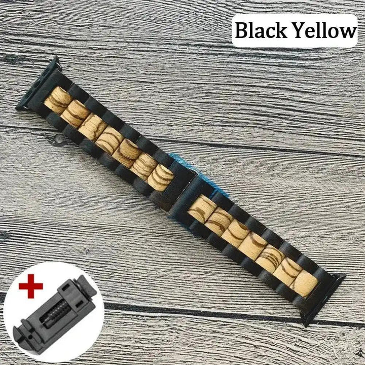 Handcrafted black and natural wood Apple Watch band with unique grain patterns, shown with a sizing tool.