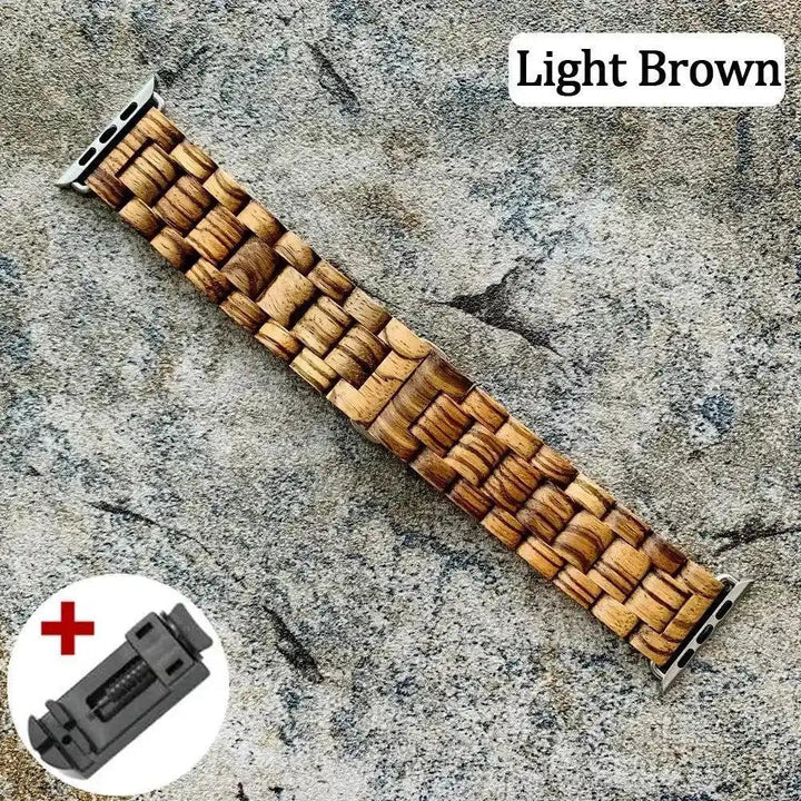 Light brown handcrafted wooden Apple Watch band with unique grain, shown with a link removal tool.